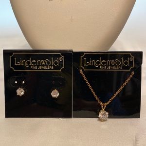 The 17 1/5” gold tone necklace & pierced earrings have zirconium stones.